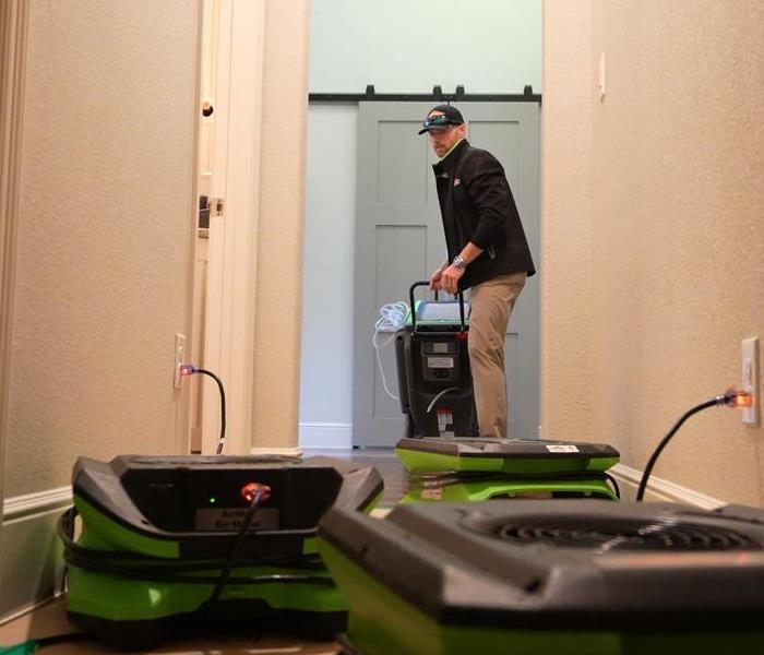 SERVPRO Team Shaw using specialized equipment to clean up water damage.